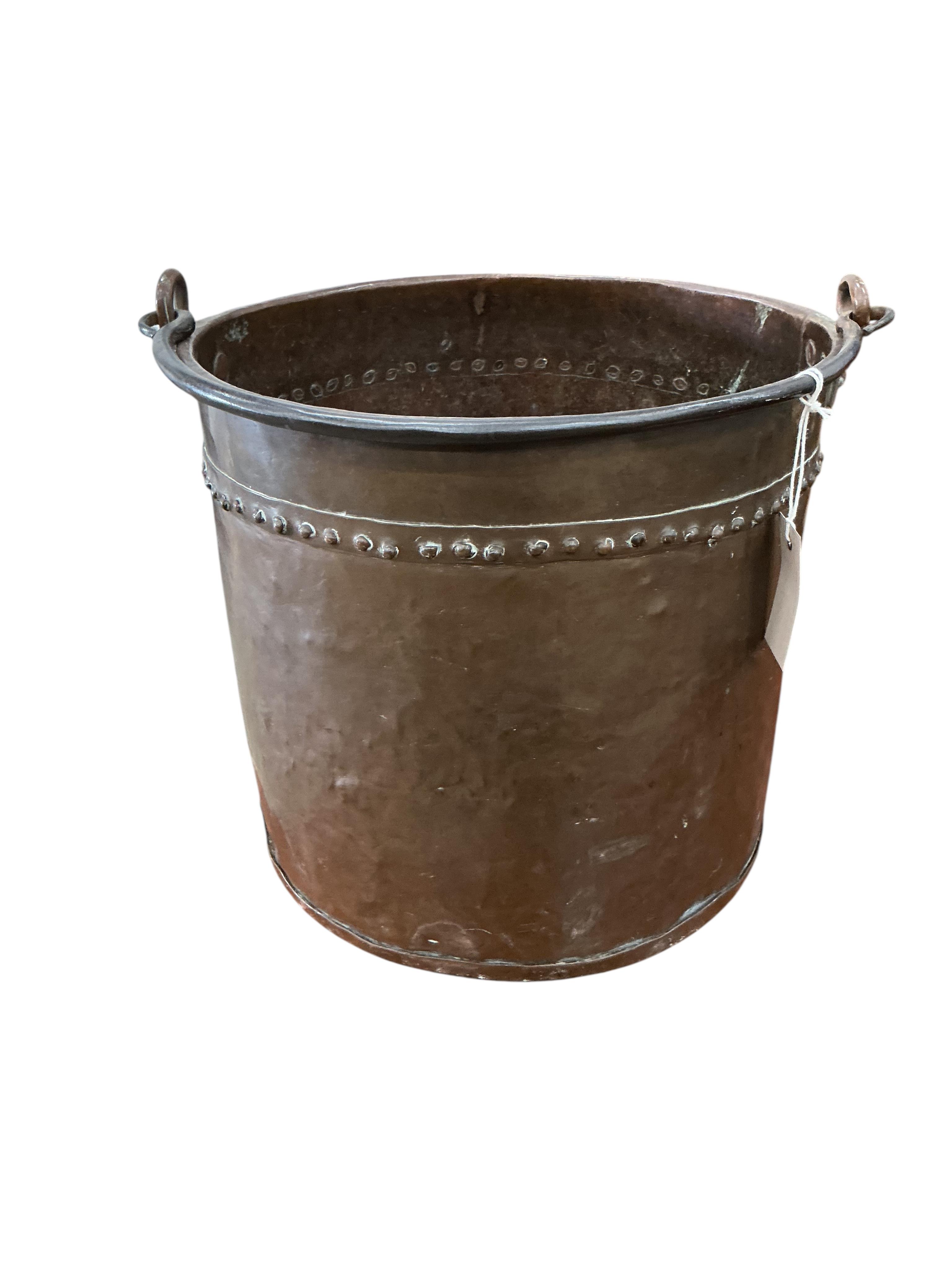 A Victorian brass mounted oak fire bellows, a circular copper log bin and assorted implements